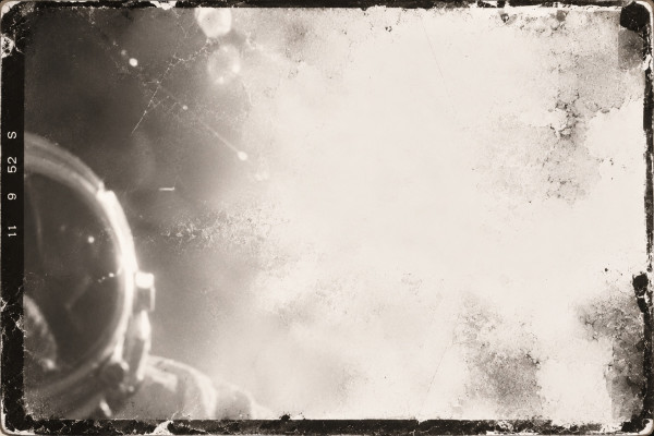 Damaged film frame: a helmet visor at the edge of the picture, most of the exposure lost to light fogging