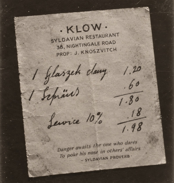 A creased restaurant bill, photographed: printed KLOW, Syldavian Restaurant, 38 Nightingale Road, Prop. J. Knoszvitch; handwritten, one szlaszeck 1.20, one szpradj .60, service 10% .18, total 1.98; printed at the foot, Danger awaits the one who dares to poke his nose in others' affairs, Syldavian proverb