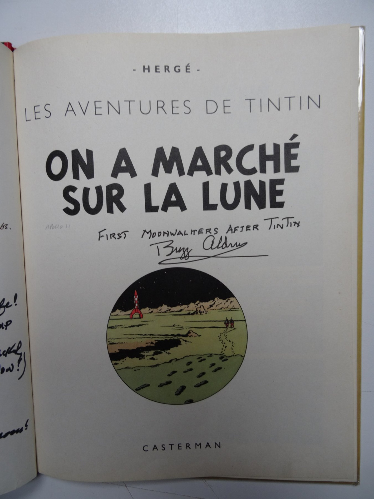 Title page of Explorers on the Moon album with handwritten dedication and signature
