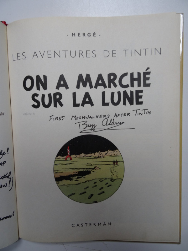 Title page of Explorers on the Moon album with handwritten dedication and signature