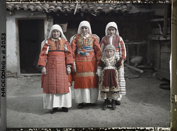 Autochrome portrait of three Serbian girls and a child in urban dress at Monastir Bitola