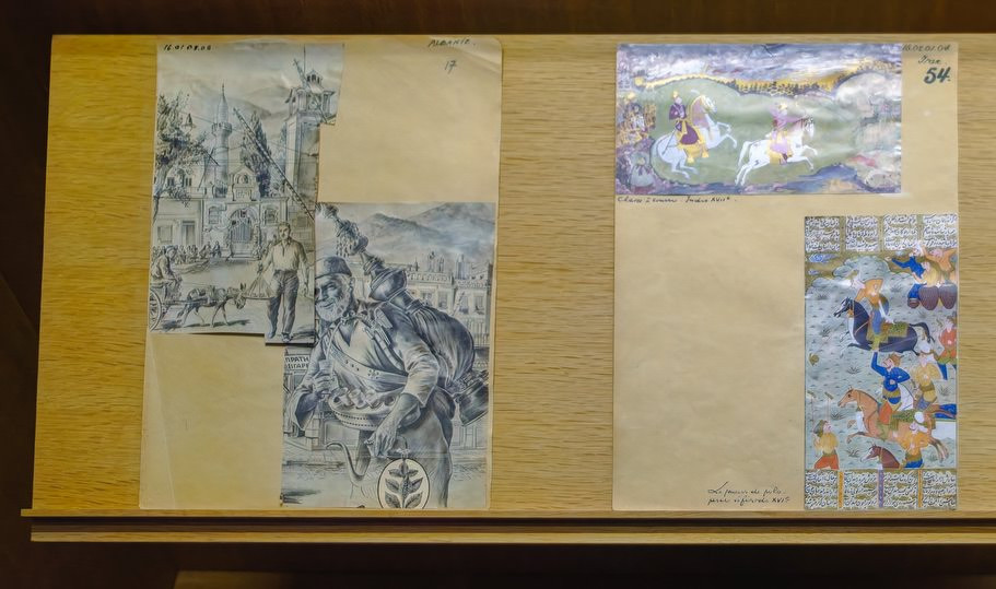 Museum exhibit showing Albanian and Persian visual influences on Syldavian artwork