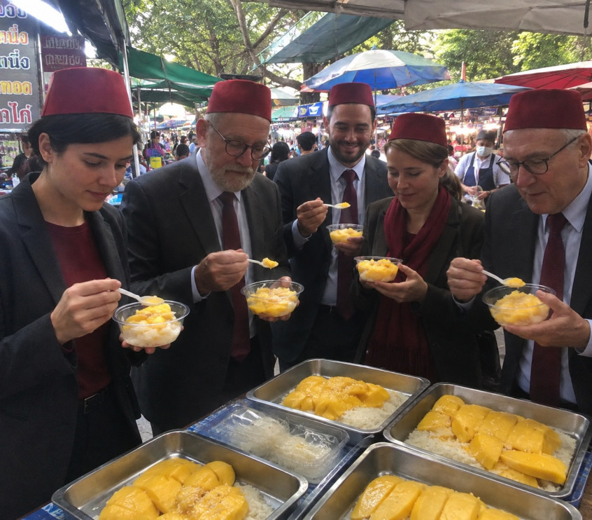 Consular team enjoying mango sticky rice